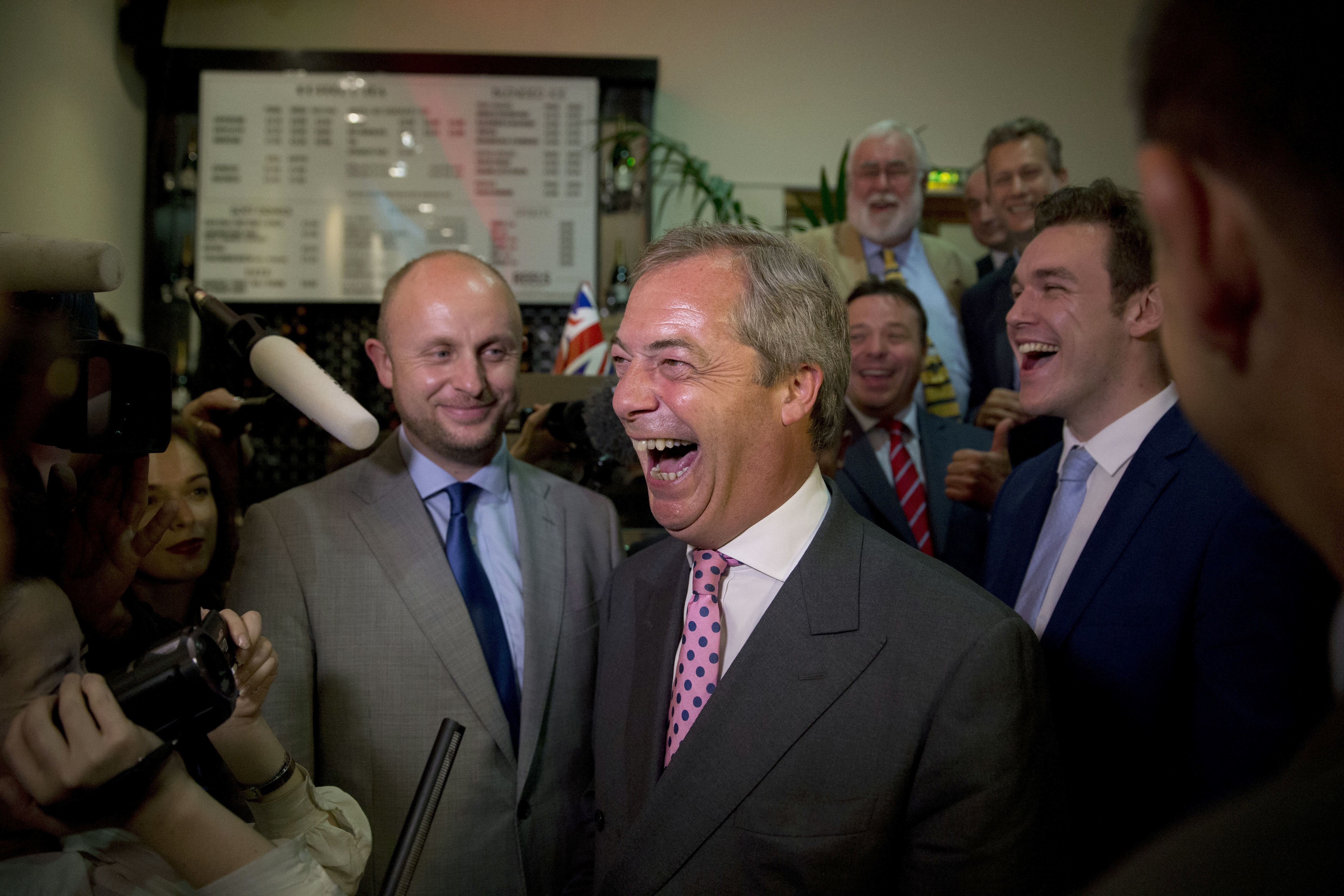 Nigel Farage, the leader of the UK Independence Party, reacts in celebration at a "Leave.EU" organization party for the British European Union membership referendum in London, Friday, June 24, 2016. Farage said he thinks the "leave" side will win in Britain's historic referendum on European Union membership. (AP Photo/Matt Dunham)