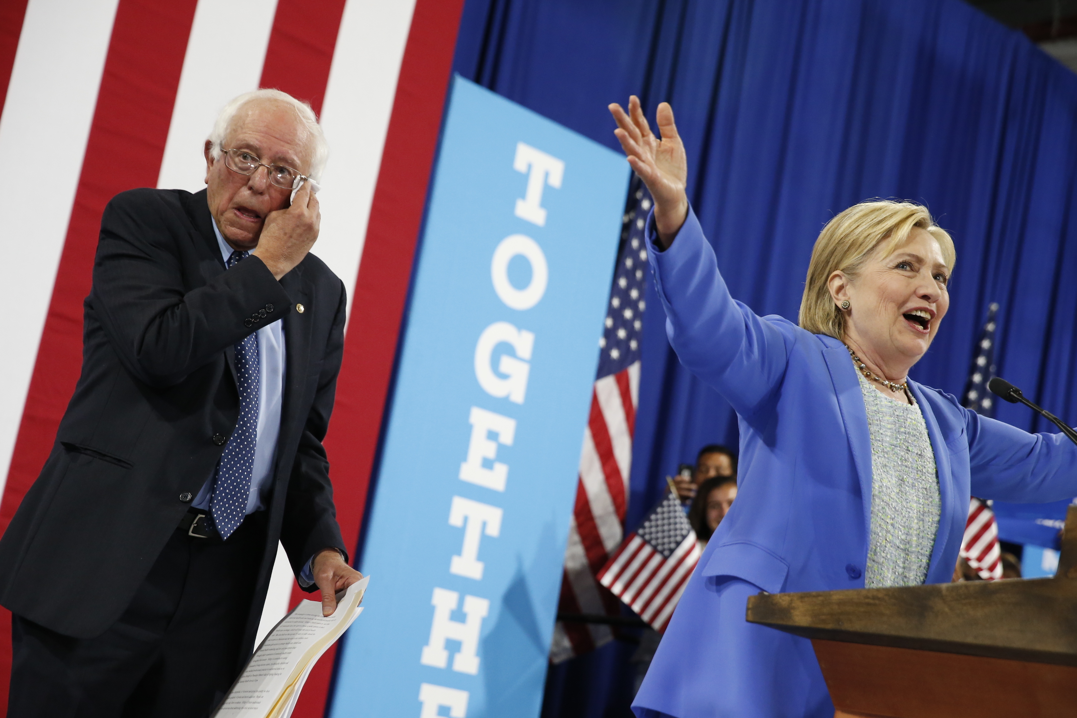 Democratic presidential candidate Hillary Clinton, accompanied by Sen. Bernie Sanders, I-Vt., speaks at a rally in Portsmouth, N.H., Tuesday, July 12, 2016, after Sanders introduced her and endorsed her for president. (AP Photo/Andrew Harnik)