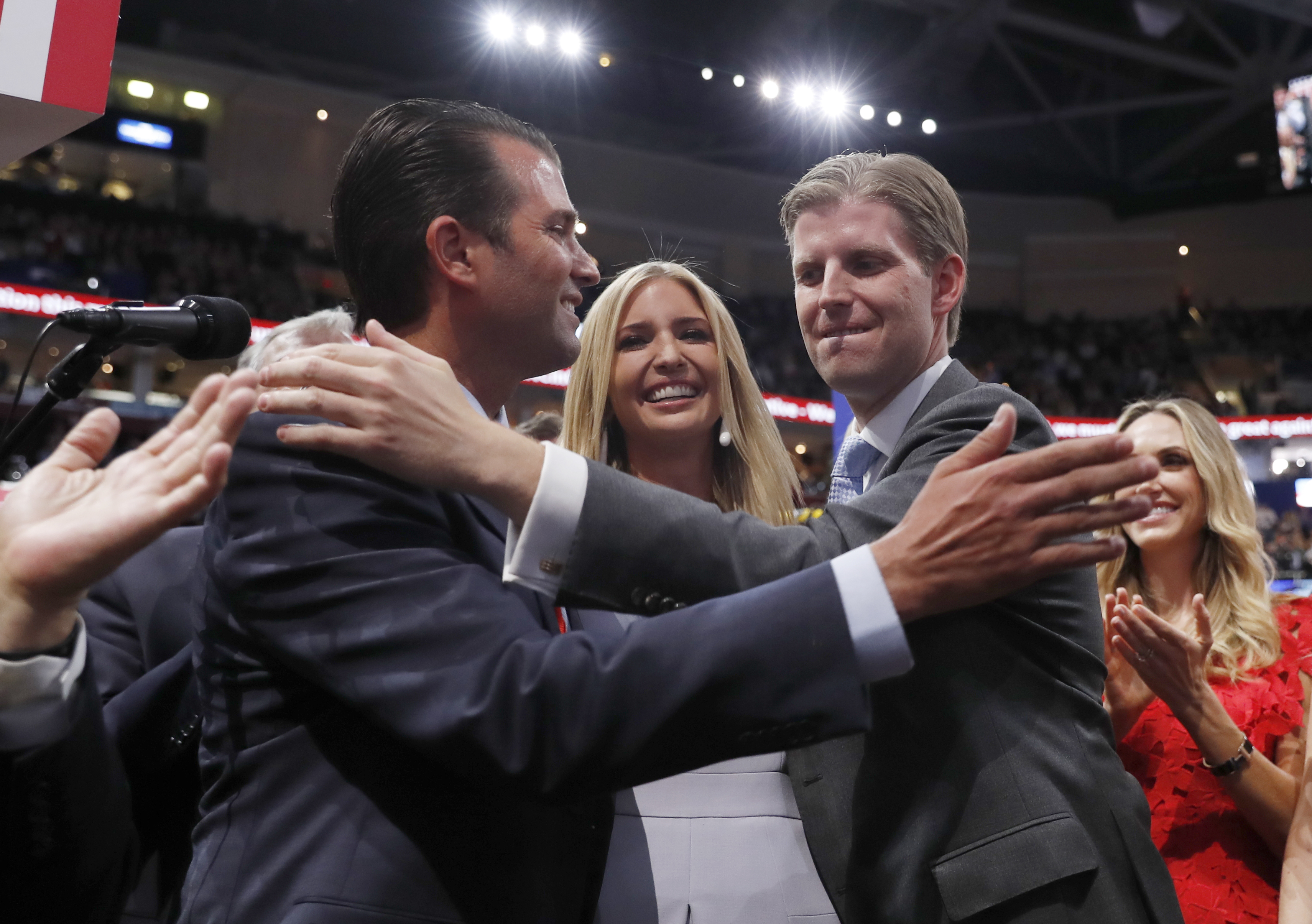 Republican Presidential Candidate Donald Trump's children Donald Trump, Jr., Ivanka Trump, and Eric Trump celebrate on the convention floor during the second day session of the Republican National Convention in Cleveland, Tuesday, July 19, 2016. (AP Photo/Carolyn Kaster)