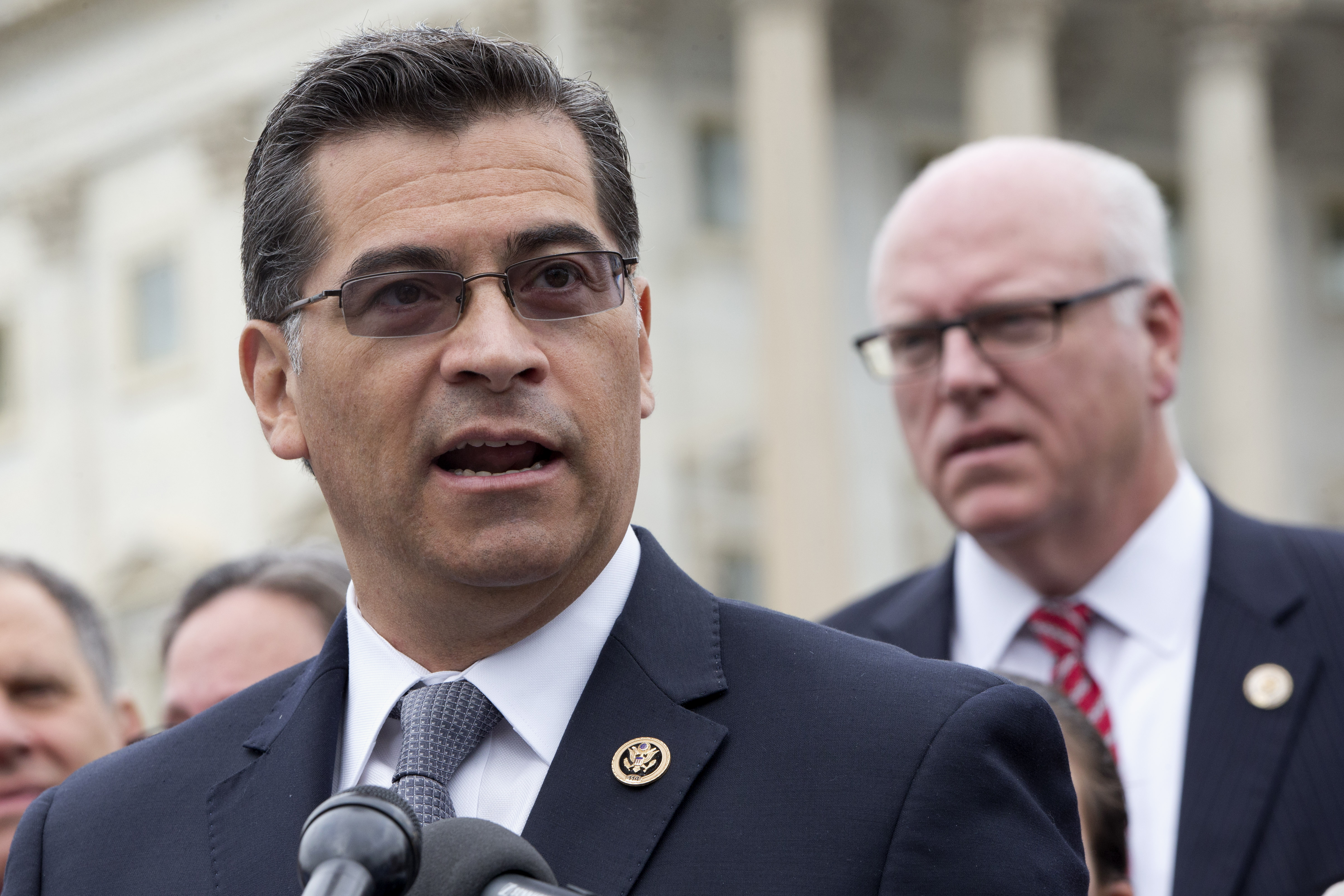Democratic Caucus Chairman Rep. Xavier Becerra, D-Calif., left, accompanied by Rep. Joseph Crowley, D-N.Y., speaks during a news conference on Medicare Part B premiums and deductibles for seniors, Wednesday, Oct. 7, 2015, on Capitol Hill in Washington. (AP Photo/Jacquelyn Martin)
