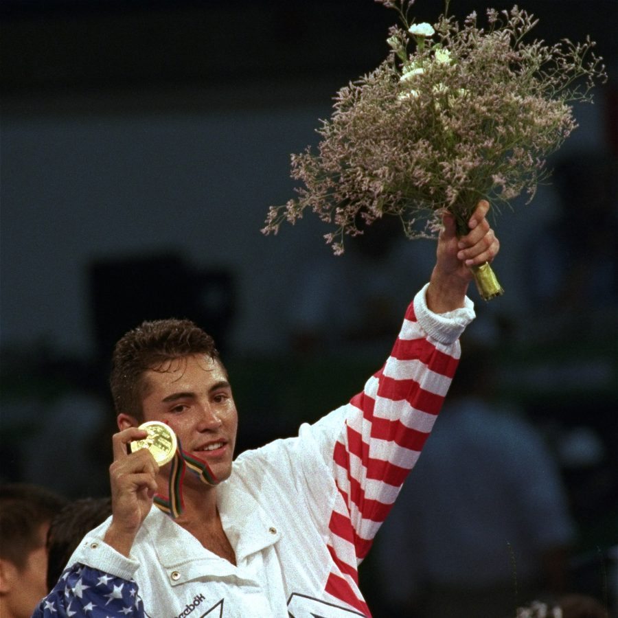 USA's Oscar De La Hoya shows off his gold medal during the award ceremony for lightweight boxing division in the XXV Summer Olympic Games in Barcelona Saturday, August 8, 1992. (AP Photo/Mark Duncan)