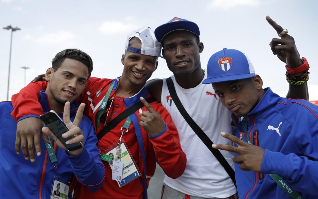 Cuban boxers, from left, Robeisy Ram'rez, Roniel Iglesias, Julio Cesar La Cruz, and Joahnys Argilagos poses at Athletes Village atthe 2016 Summer Olympics in Rio de Janeiro, Brazil, Thursday, Aug. 4, 2016. (AP Photo/Robert F. Bukaty)