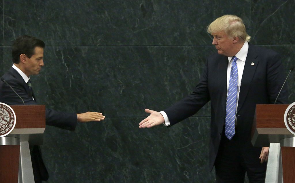 Mexico's President Enrique Pena Nieto and Republican presidential nominee Donald Trump shake hands after a joint statement at Los Pinos, the presidential official residence, in Mexico City, Wednesday, Aug. 31, 2016. Trump is calling his surprise visit to Mexico City a 'great honor.' The Republican presidential nominee said after meeting with Pena Nieto that the pair had a substantive, direct and constructive exchange of ideas.(AP Photo/Marco Ugarte)