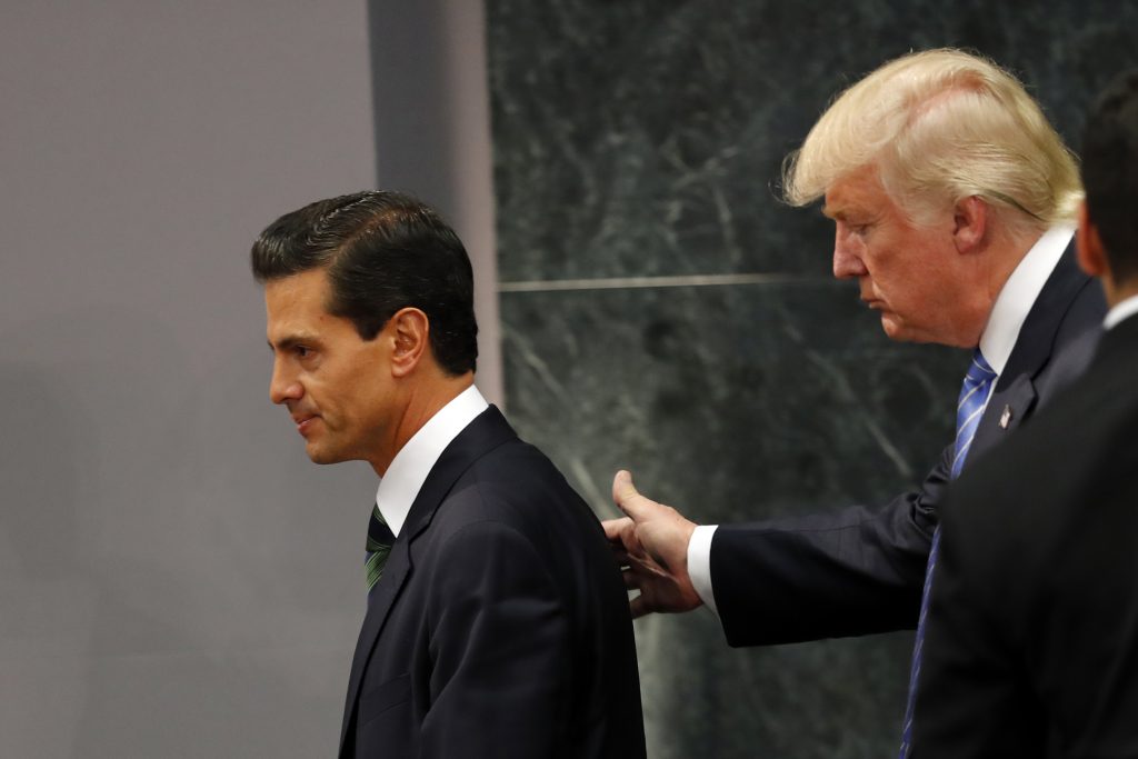 Republican presidential nominee Donald Trump walks with Mexico President Enrique Pena Nieto at the end of their joint statement at Los Pinos, the presidential official residence, in Mexico City, Wednesday, Aug. 31, 2016. Trump is calling his surprise visit to Mexico City Wednesday a 'great honor.' The Republican presidential nominee said after meeting with Peña Nieto that the pair had a substantive, direct and constructive exchange of ideas.(AP Photo/Dario Lopez-Mills)